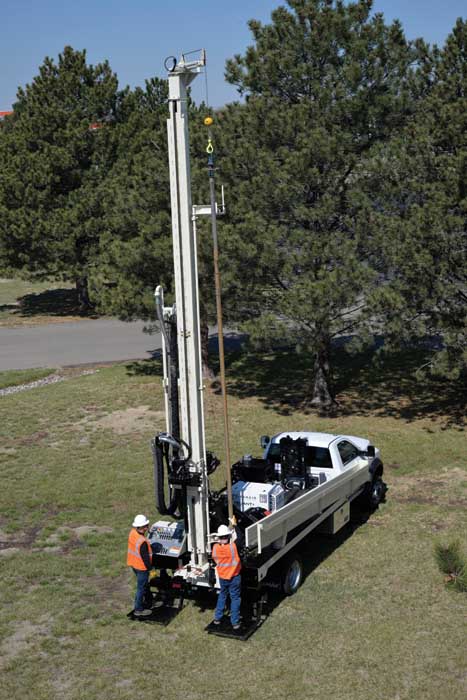 The DRILLMAX® DM250 by Geoprobe® is easy to operate with a two-man crew.  The helper loads the drill pipe in the single rod loader using helper side controls to operate the jib and winch functions.
